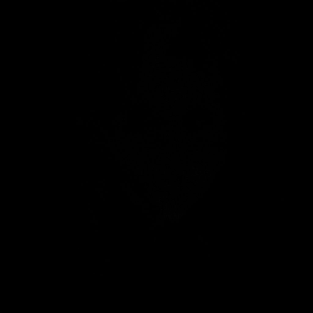 Photographie sombre d'un ordinateur sur un bureau, ambiance feutrée aux tons discrets